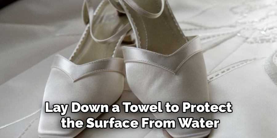 Lay Down a Towel to Protect
the Surface From Water